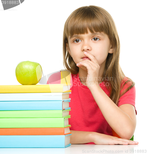 Image of Little girl with her books