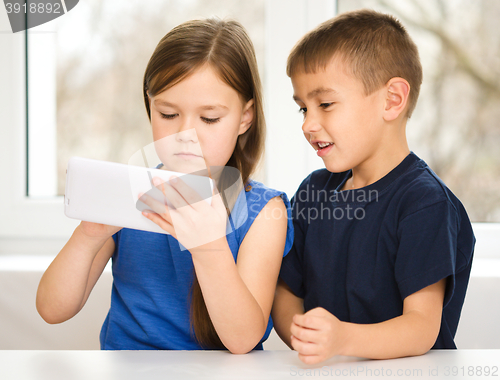 Image of Children are using tablet