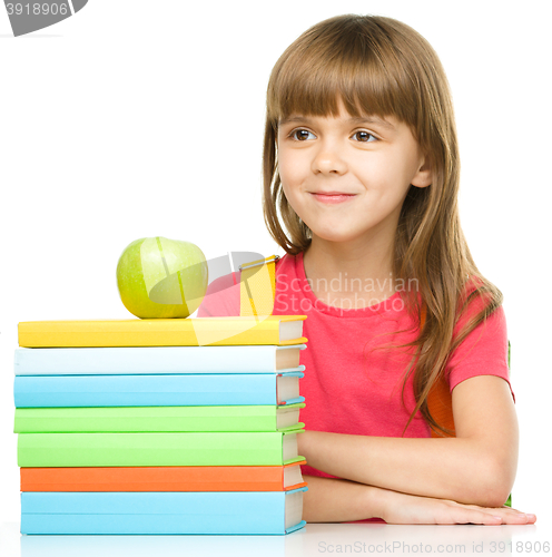 Image of Little girl with her books