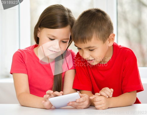 Image of Children are using tablet