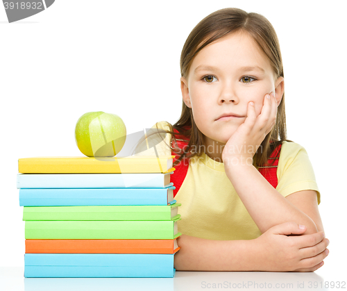 Image of Little girl with her books