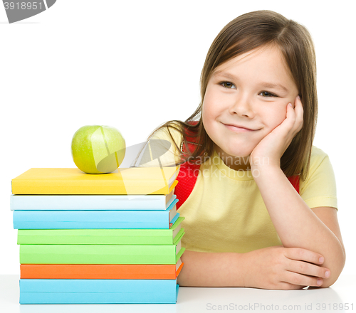 Image of Little girl with her books