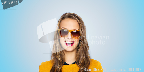 Image of happy young woman or teen girl in sunglasses