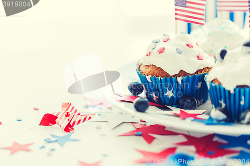 Image of cupcakes with american flags on independence day