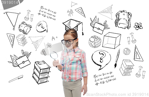 Image of little girl in eyeglasses with magnifying glass