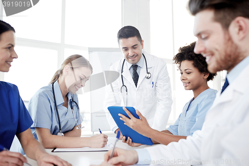 Image of group of happy doctors meeting at hospital office