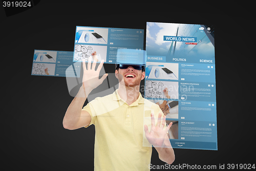 Image of happy man in virtual reality headset or 3d glasses