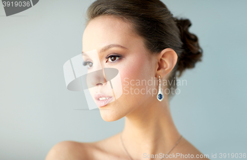 Image of close up of beautiful woman face with earring