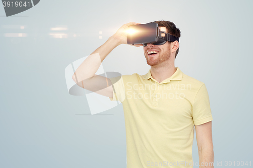 Image of happy man in virtual reality headset or 3d glasses