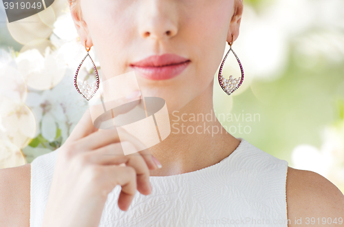 Image of close up of beautiful woman face with earrings