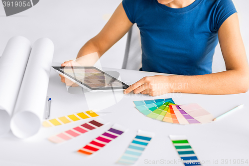 Image of woman working with color samples for selection