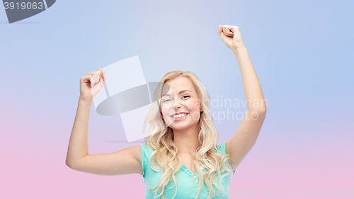 Image of happy young woman or teen girl celebrating victory