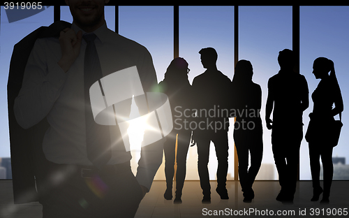 Image of people silhouettes over office background