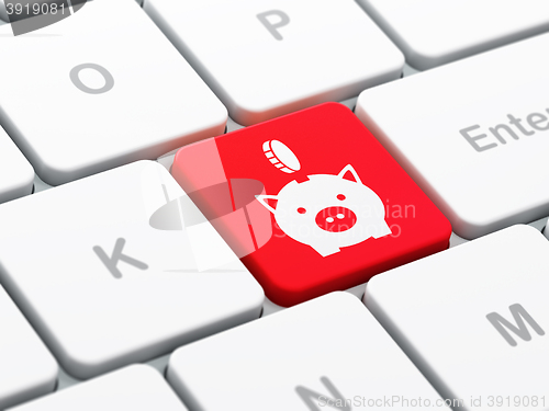 Image of Money concept: Money Box With Coin on computer keyboard background