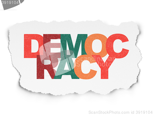 Image of Political concept: Democracy on Torn Paper background