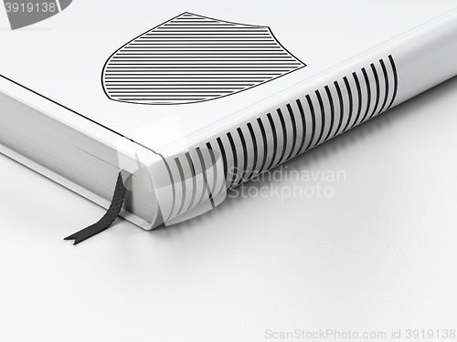 Image of Security concept: closed book, Shield on white background