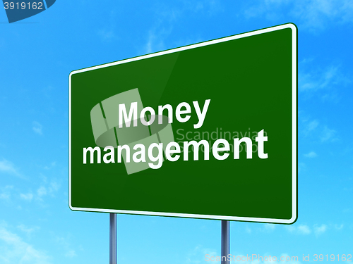 Image of Currency concept: Money Management on road sign background