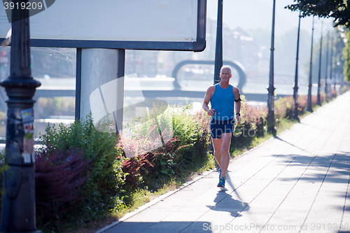 Image of handsome senior man  jogging