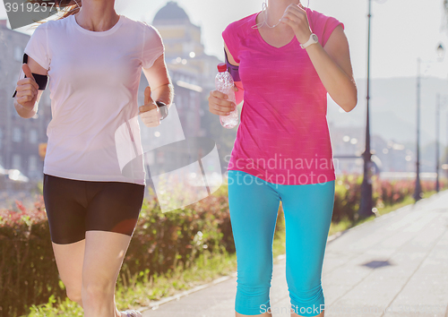 Image of female friends jogging