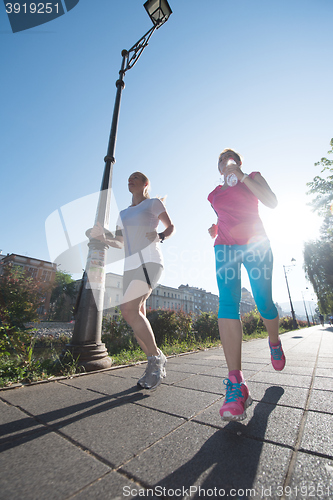 Image of female friends jogging