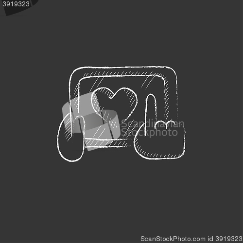 Image of Hands holding tablet with heart sign. Drawn in chalk icon.