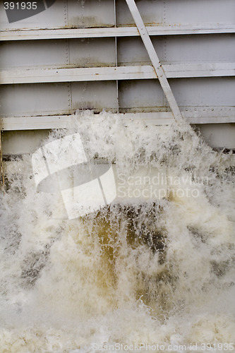 Image of Water pouring out of canal lock