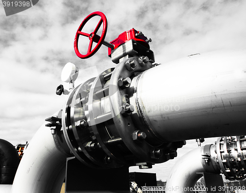 Image of Industrial zone, Steel pipelines and valves against blue sky