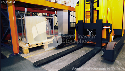 Image of Shelves, racks and forklift  with pallets in distribution wareho