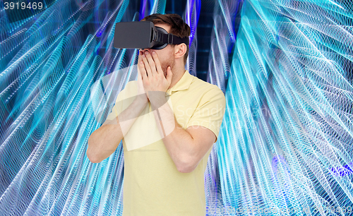 Image of happy man in virtual reality headset or 3d glasses