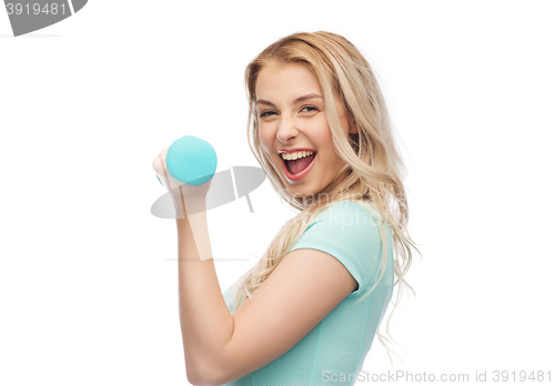 Image of smiling beautiful young sporty woman with dumbbell