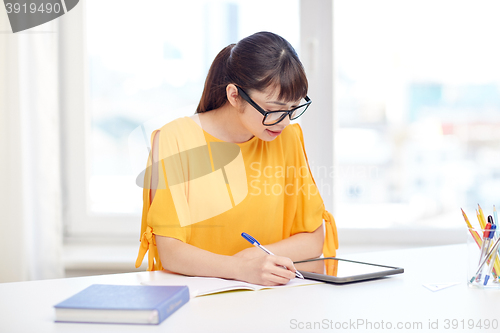 Image of asian woman student with tablet pc at home