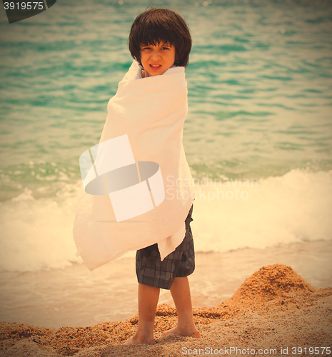 Image of young swimmer wrapped in a towel