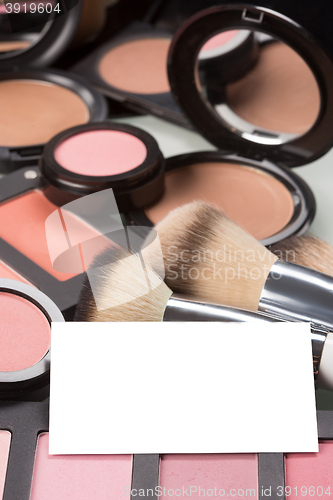 Image of makeup cosmetics for eyes and bussiness card