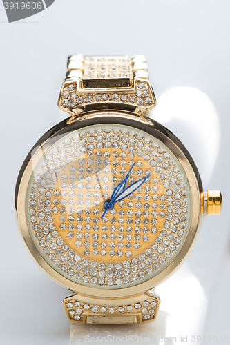 Image of gold watch with diamonds