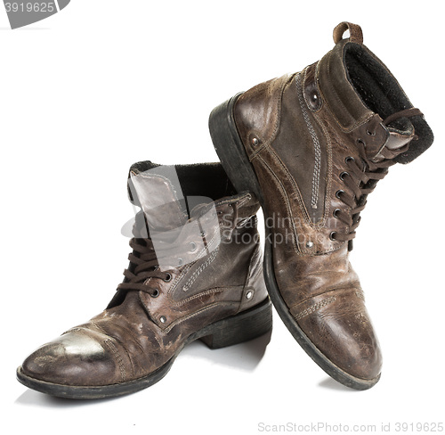 Image of Dirty old boots isolated. white background