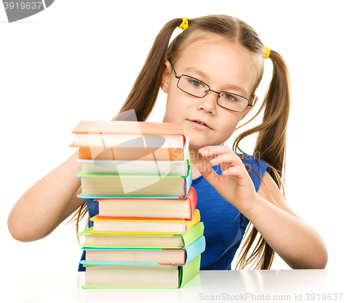 Image of Little girl with books
