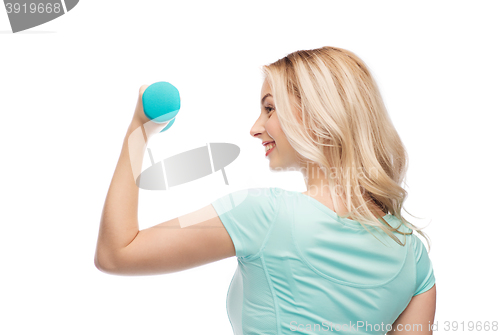 Image of smiling beautiful young sporty woman with dumbbell