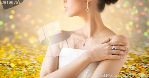 Image of close up of beautiful woman with finger ring