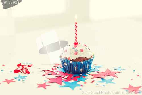 Image of cupcake with candle on american independence day