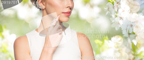 Image of close up of beautiful woman with ring and earring