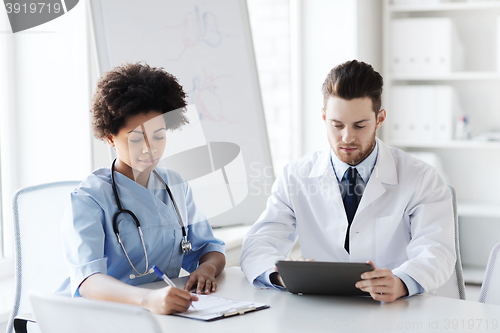 Image of two doctors meeting at hospital office
