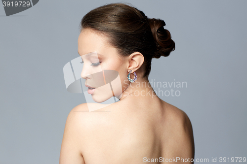 Image of close up of beautiful woman face with earring