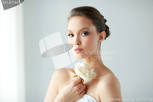 Image of beautiful asian woman with flower and jewelry