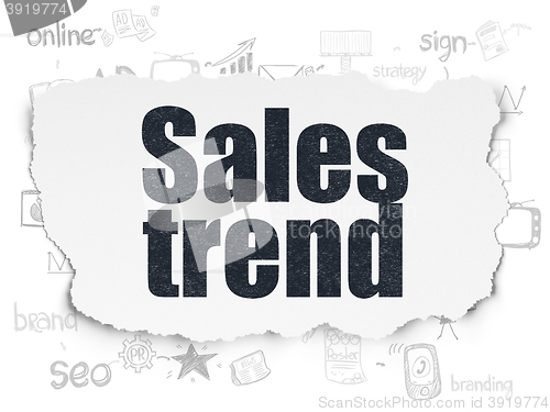 Image of Advertising concept: Sales Trend on Torn Paper background