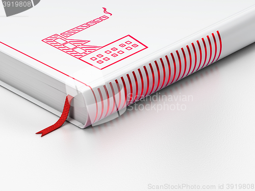 Image of Manufacuring concept: closed book, Industry Building on white background