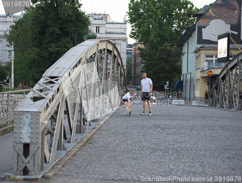 Image of couple warming up and stretching before jogging