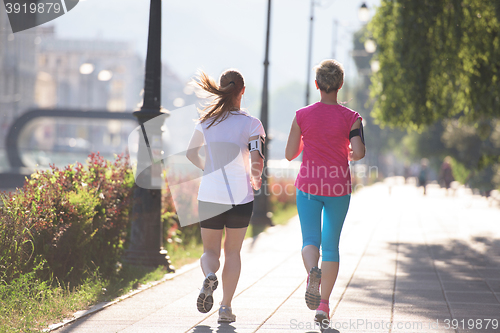 Image of female friends jogging