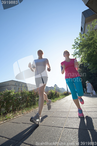 Image of female friends jogging