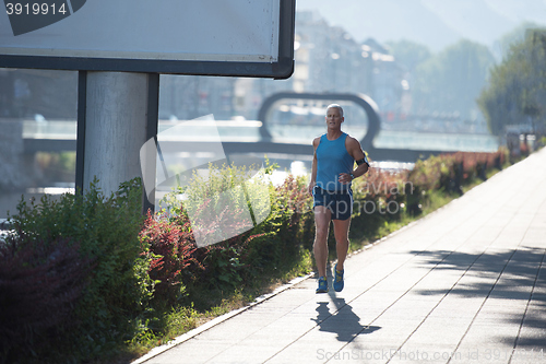 Image of handsome senior man  jogging