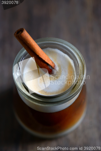 Image of Cup of espresso and cinnamon stick
